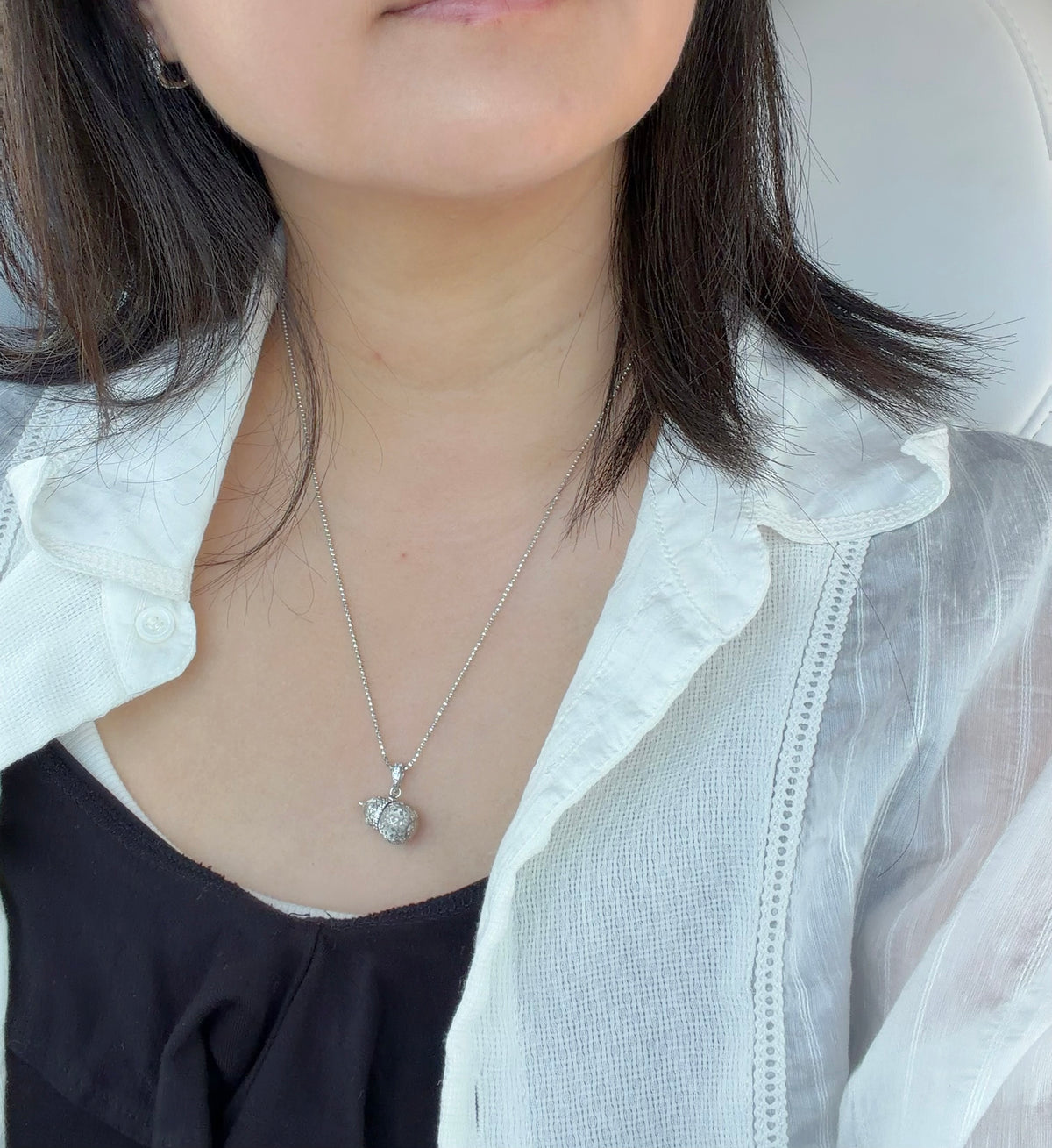 Lunelle Atelier petite auspicious gourd pendant necklace featuring a delicate carved gourd charm on a fine chain.