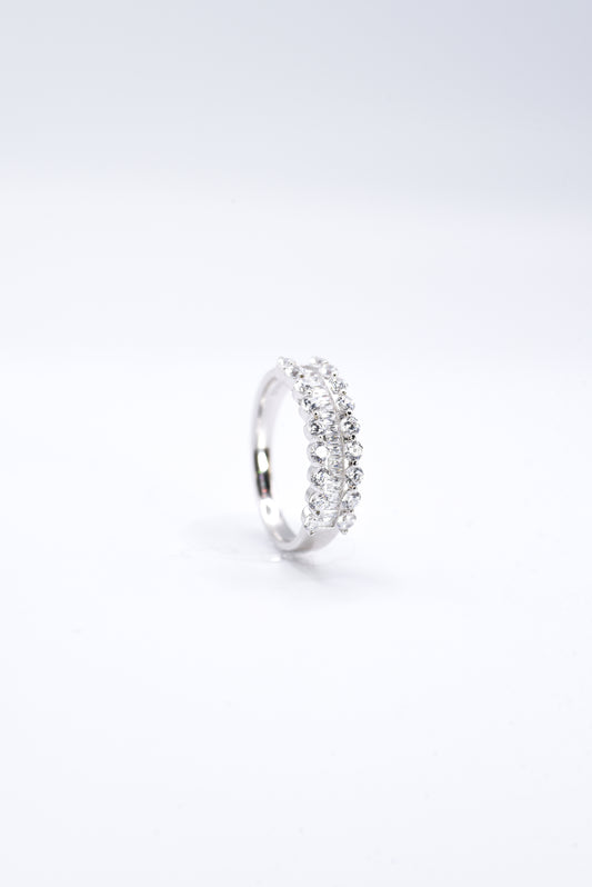 Silver ring with multiple gemstones on a white background
