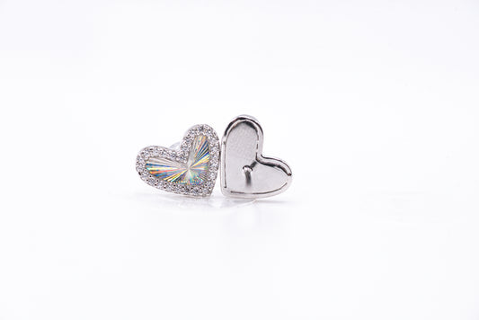 Heart-shaped silver earrings on a white background