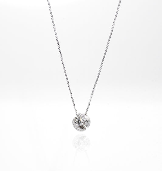 Silver necklace with a small round pendant on a white background