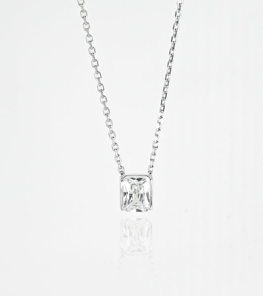 Silver necklace with a square-cut pendant on a white background