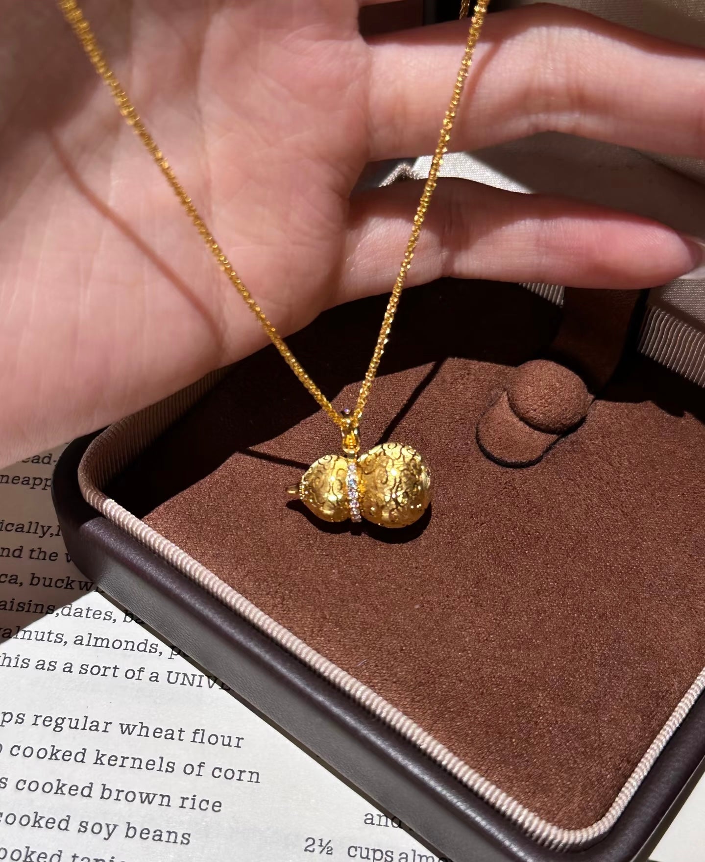 Lunelle Atelier auspicious gourd pendant necklace with intricate design, silver chain, and decorative gourd charm.