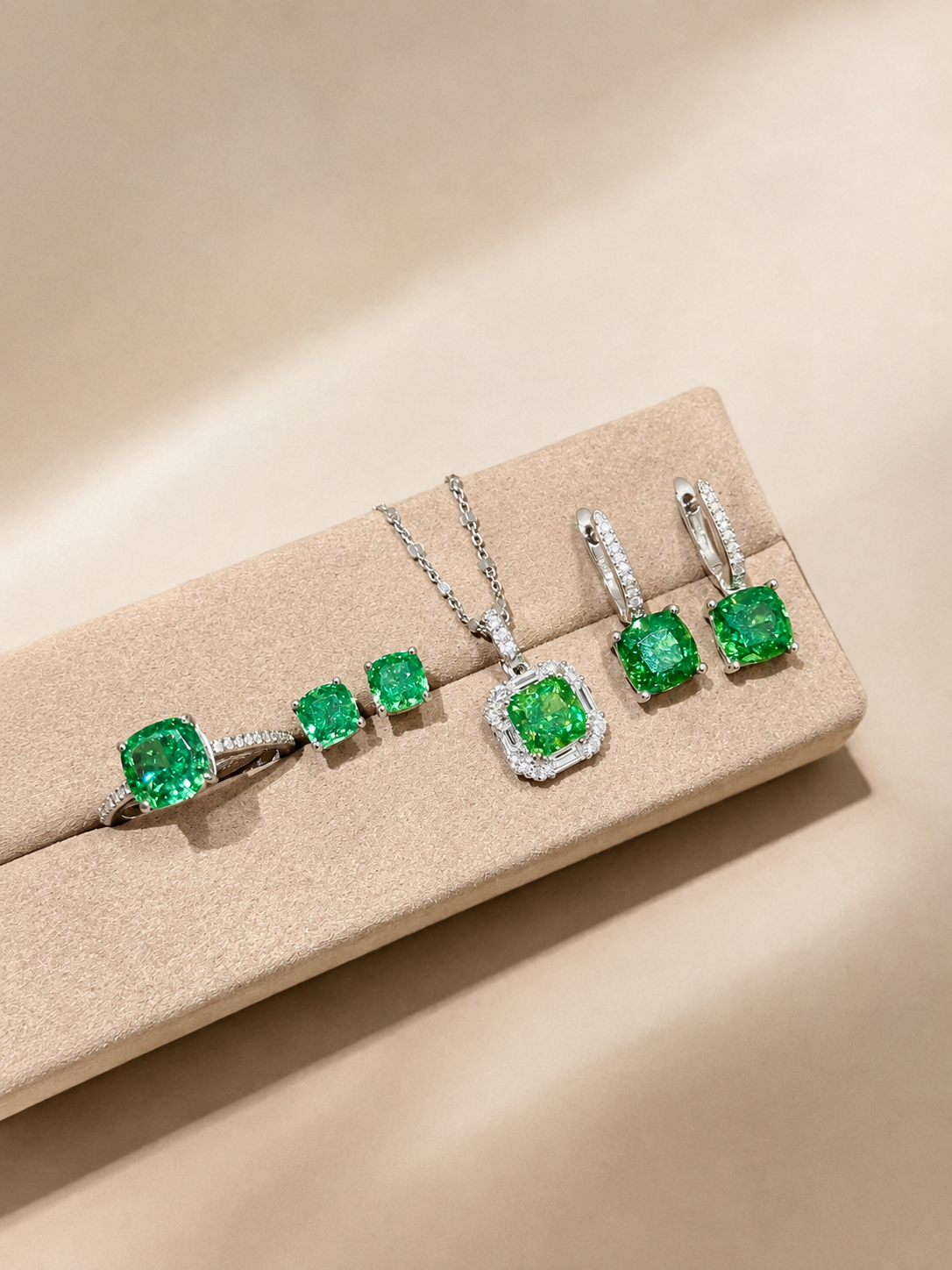 Lunelle Atelier green cushion halo pendant necklace featuring a vibrant green gemstone surrounded by a delicate halo setting.
