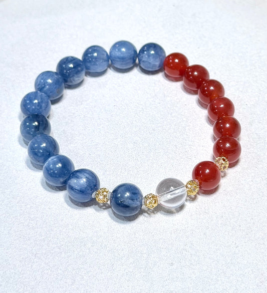 Beaded bracelet with blue, red, and clear beads on a white background