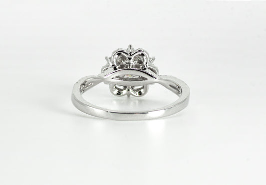 Silver ring with a diamond on a white background