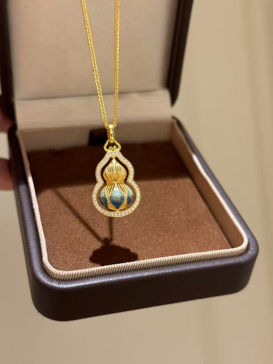 Gold necklace with a pendant in a jewelry box