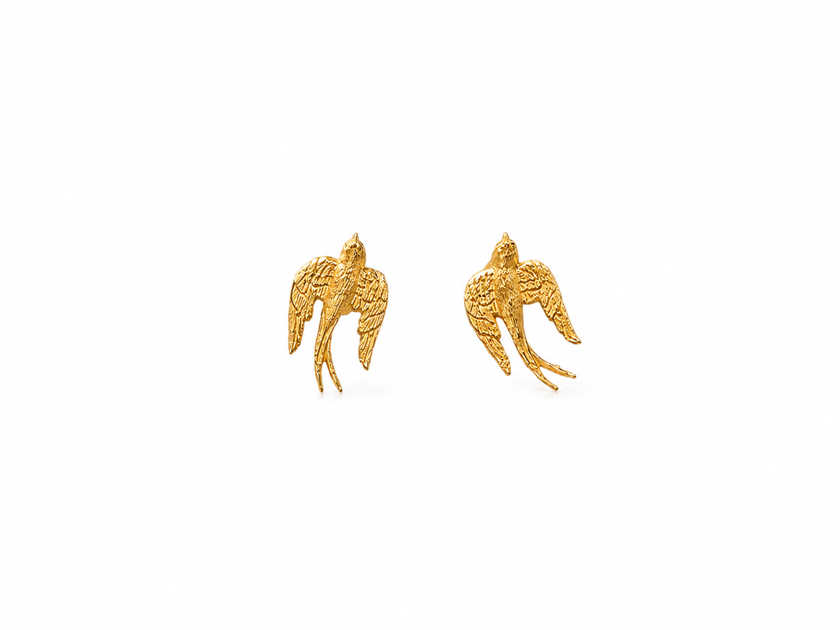 Lunelle Atelier brushed swallow stud earrings featuring sleek, minimalist metal design on a plain background