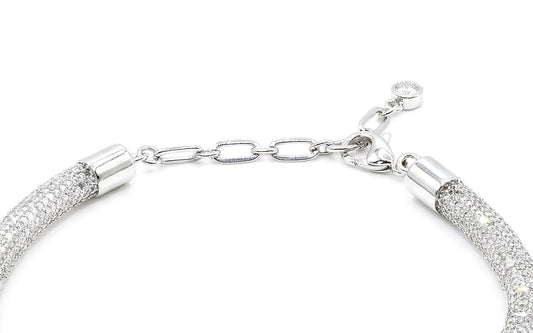 Silver bracelet with textured links on a white background