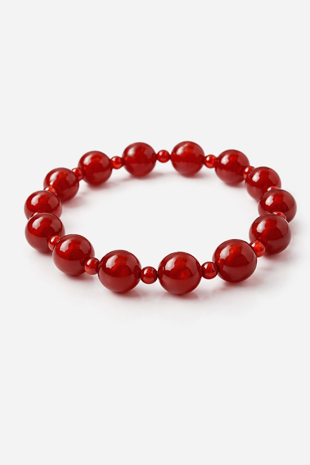 Red beaded bracelet on a white background