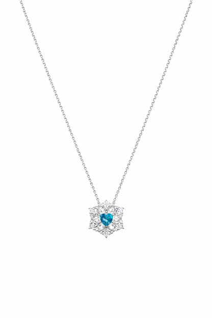Necklace with a heart-shaped blue gemstone pendant on a white background