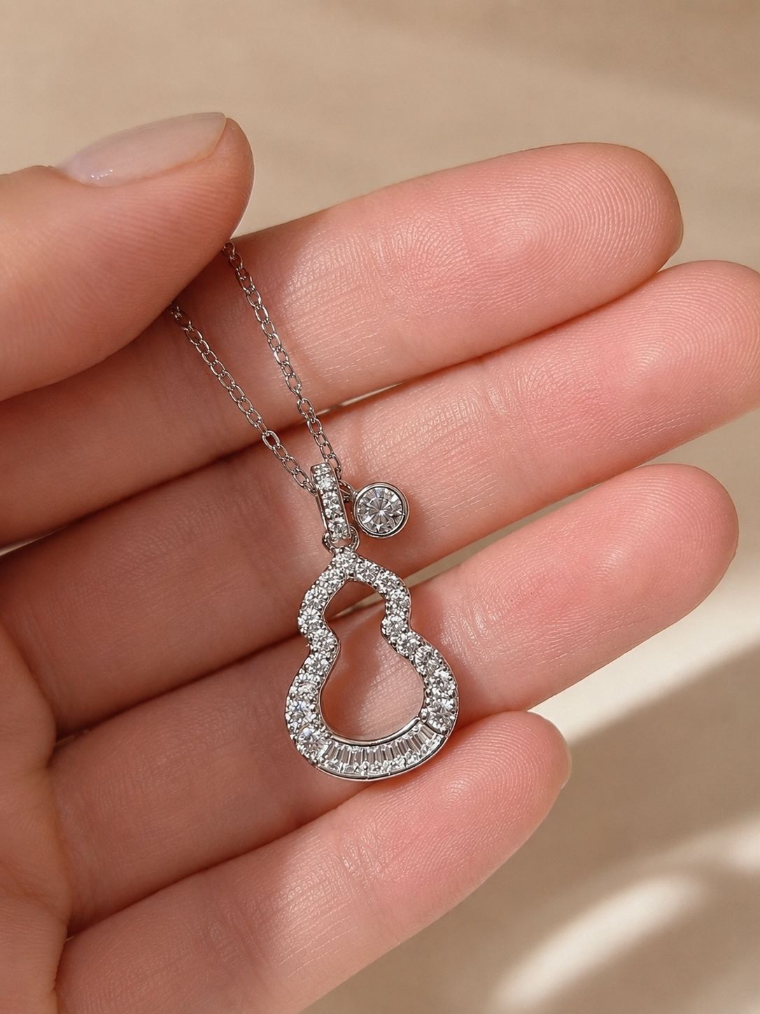 Lunelle Atelier Lucky Gourd Baguette Necklace featuring a delicate gold chain and a lucky gourd pendant.