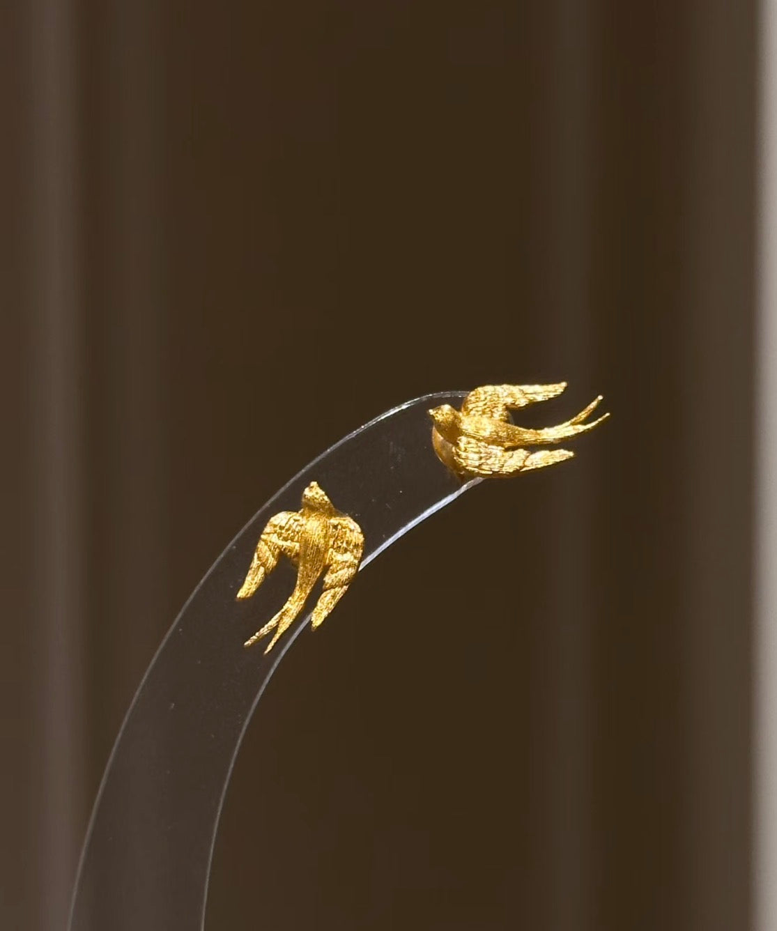 Lunelle Atelier brushed swallow stud earrings in silver with sleek, minimalist bird design on small post earrings.