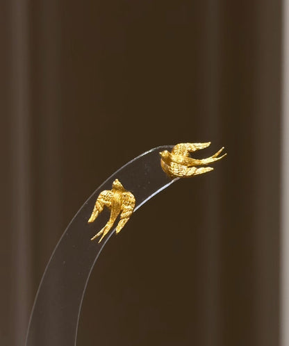 Lunelle Atelier brushed swallow stud earrings in silver with sleek, minimalist bird design on small post earrings.