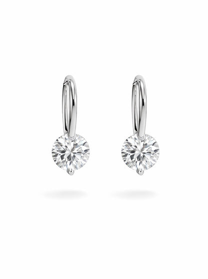 Pair of silver hoop earrings with clear gemstones on a white background