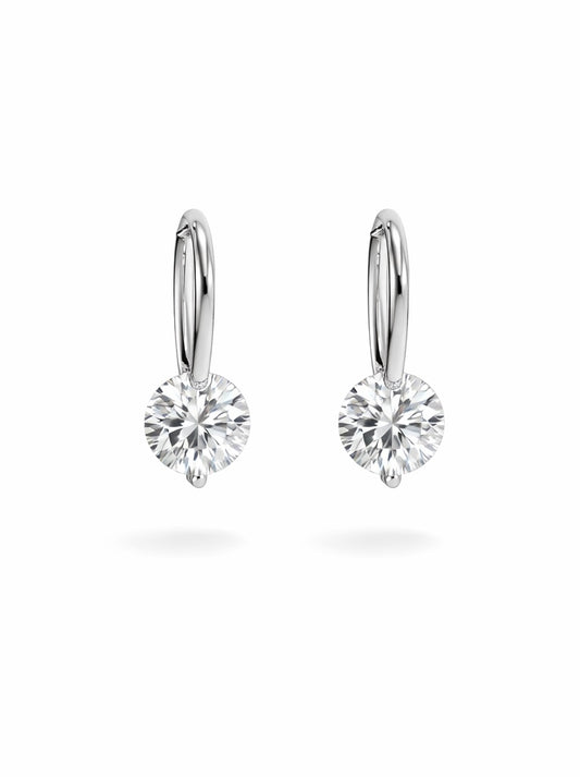 Pair of silver hoop earrings with clear gemstones on a white background