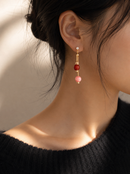 Lunelle by Heart and Hand Carnelian Pink Agate linear drop earrings with adjustable pull-through design on a white background.