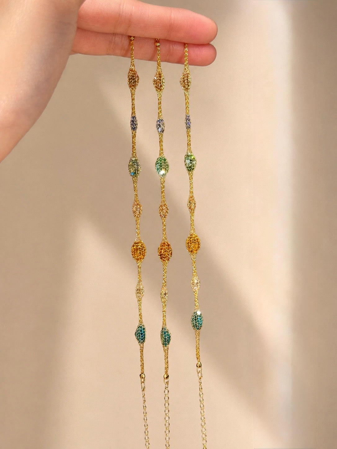 Lunelle Atelier Veil of Light woven bracelet with intricate thread pattern and delicate design on a neutral background.