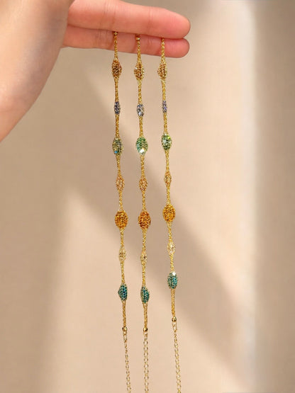 Lunelle Atelier Veil of Light woven bracelet with intricate thread pattern and delicate design on a neutral background.
