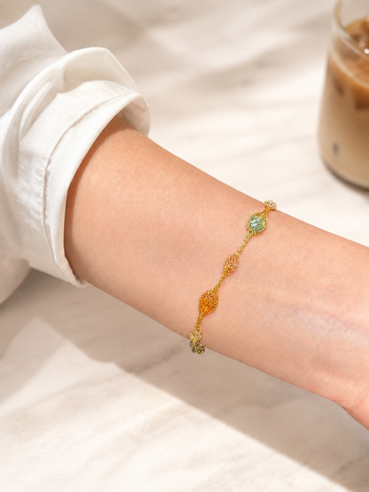 Lunelle Atelier Veil of Light woven bracelet with delicate, intricate design and subtle shimmer, close-up view of jewelry.