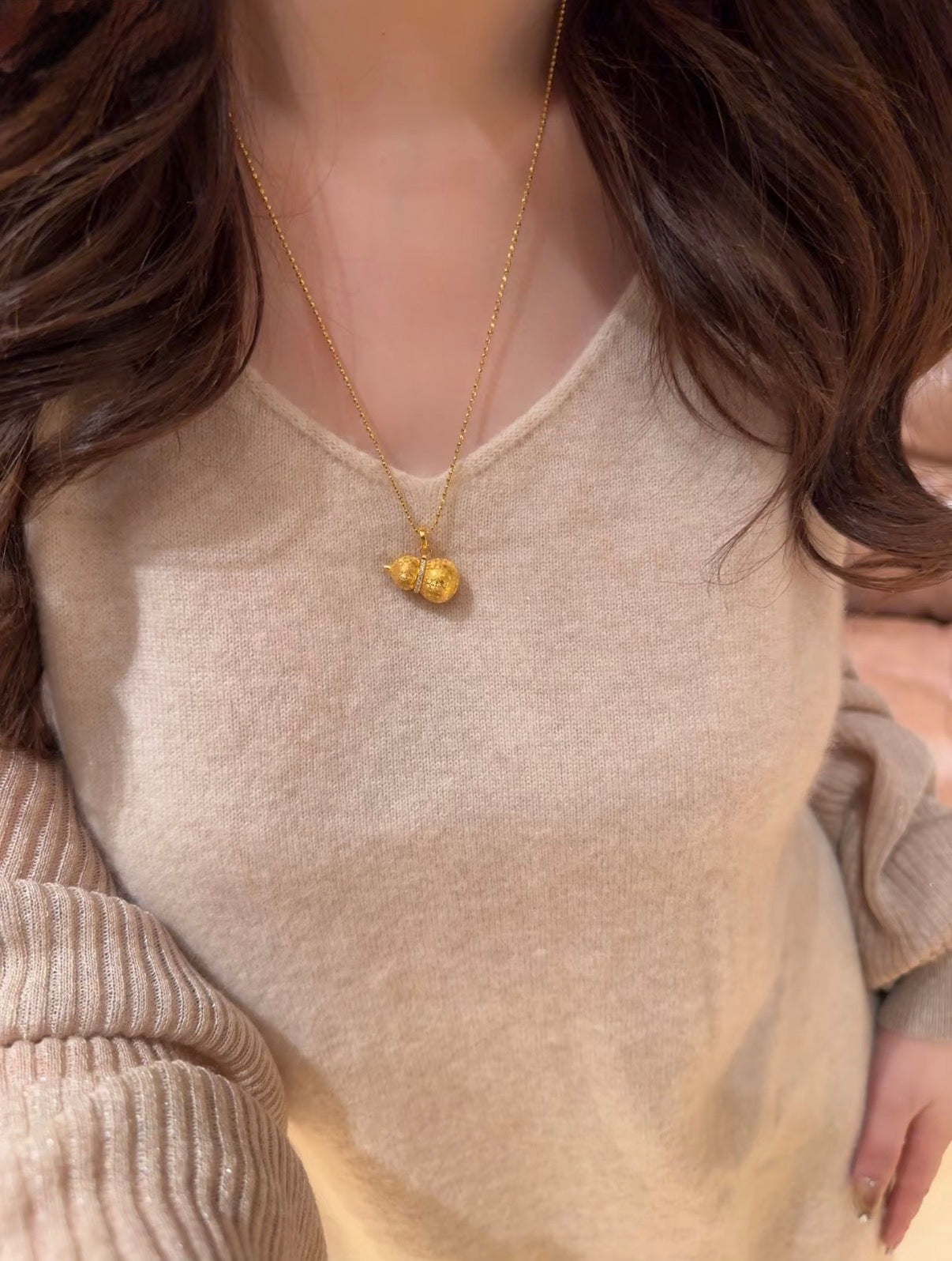 Lunelle Atelier auspicious gourd pendant necklace with a polished gold-tone gourd charm on a delicate chain.