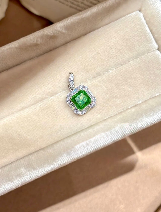 Green cushion halo pendant necklace by Lunelle Atelier featuring a large green gemstone surrounded by a delicate halo setting.