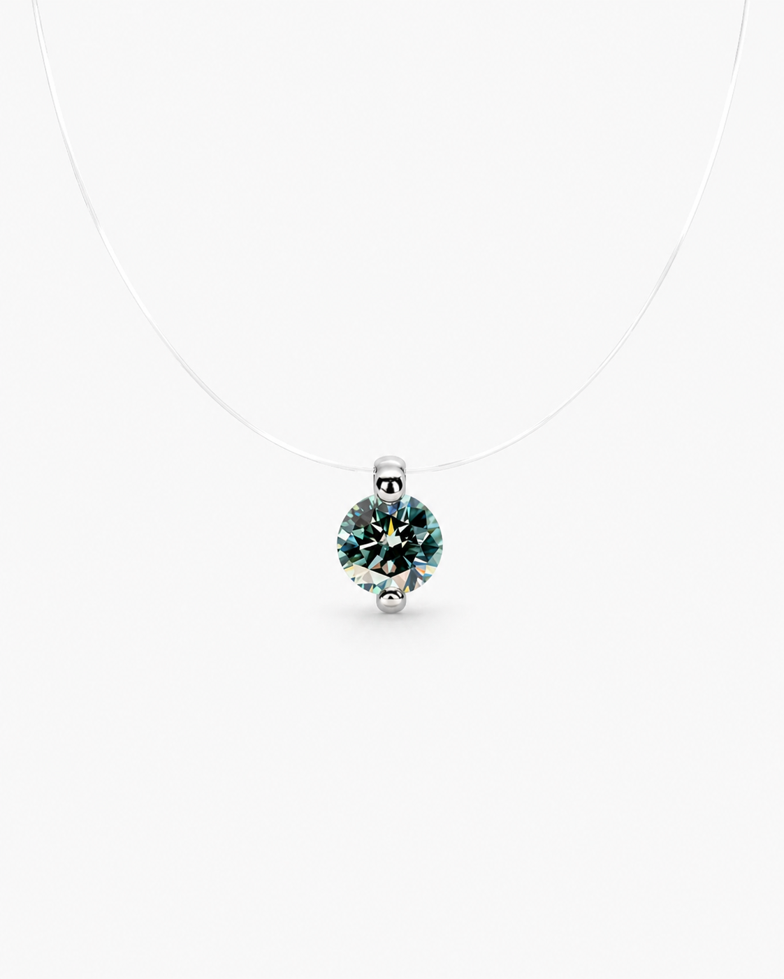 Silver pendant with a green gemstone on a white background