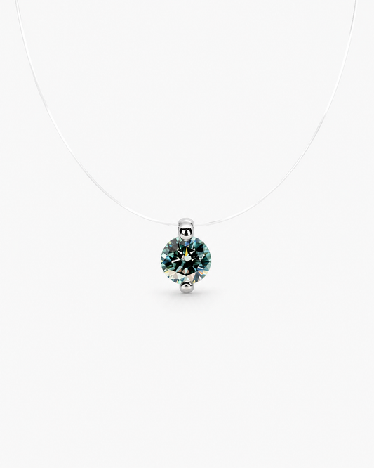 Silver pendant with a green gemstone on a white background