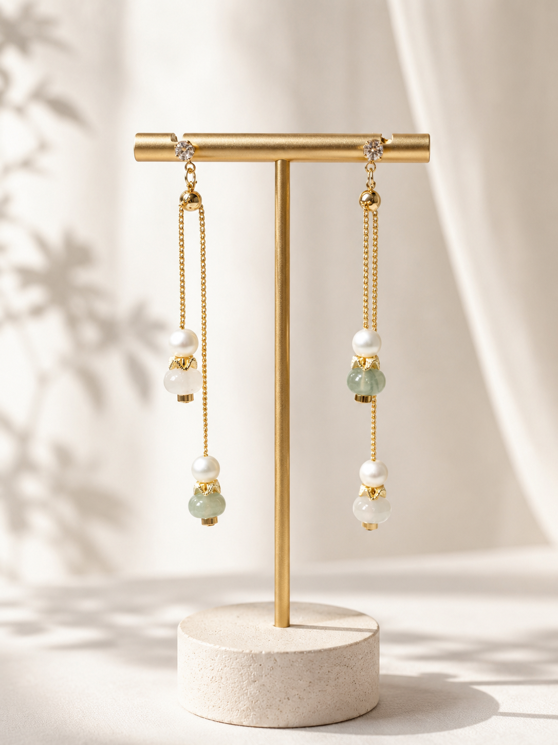 Lunelle by Heart and Hand Tianshan Jade adjustable drop earrings featuring green jade stones and delicate metal hooks.