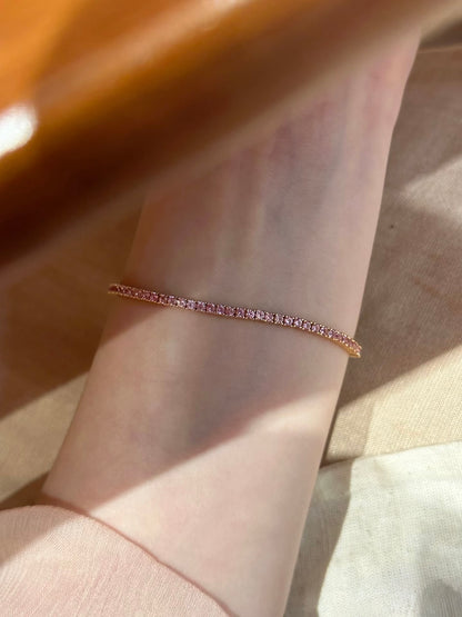 Petite Lunelle Atelier tennis bracelet with delicate chain and small sparkling gemstones on a white background.