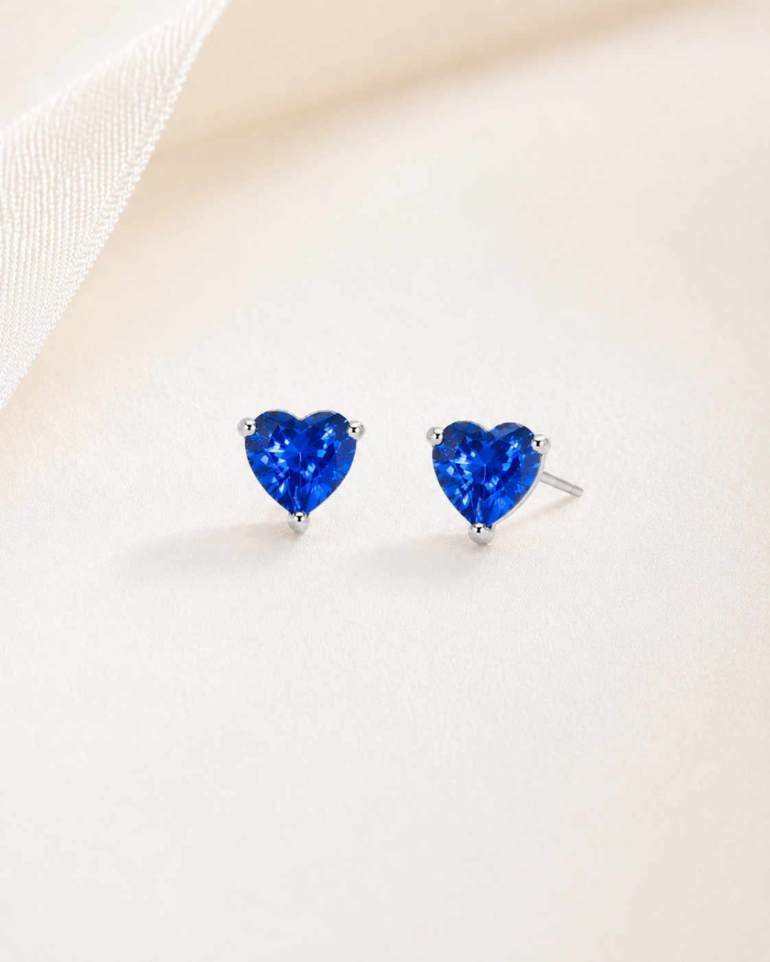 Lunelle Atelier heart-shaped gemstone stud earrings featuring sparkling gemstones and sterling silver posts.