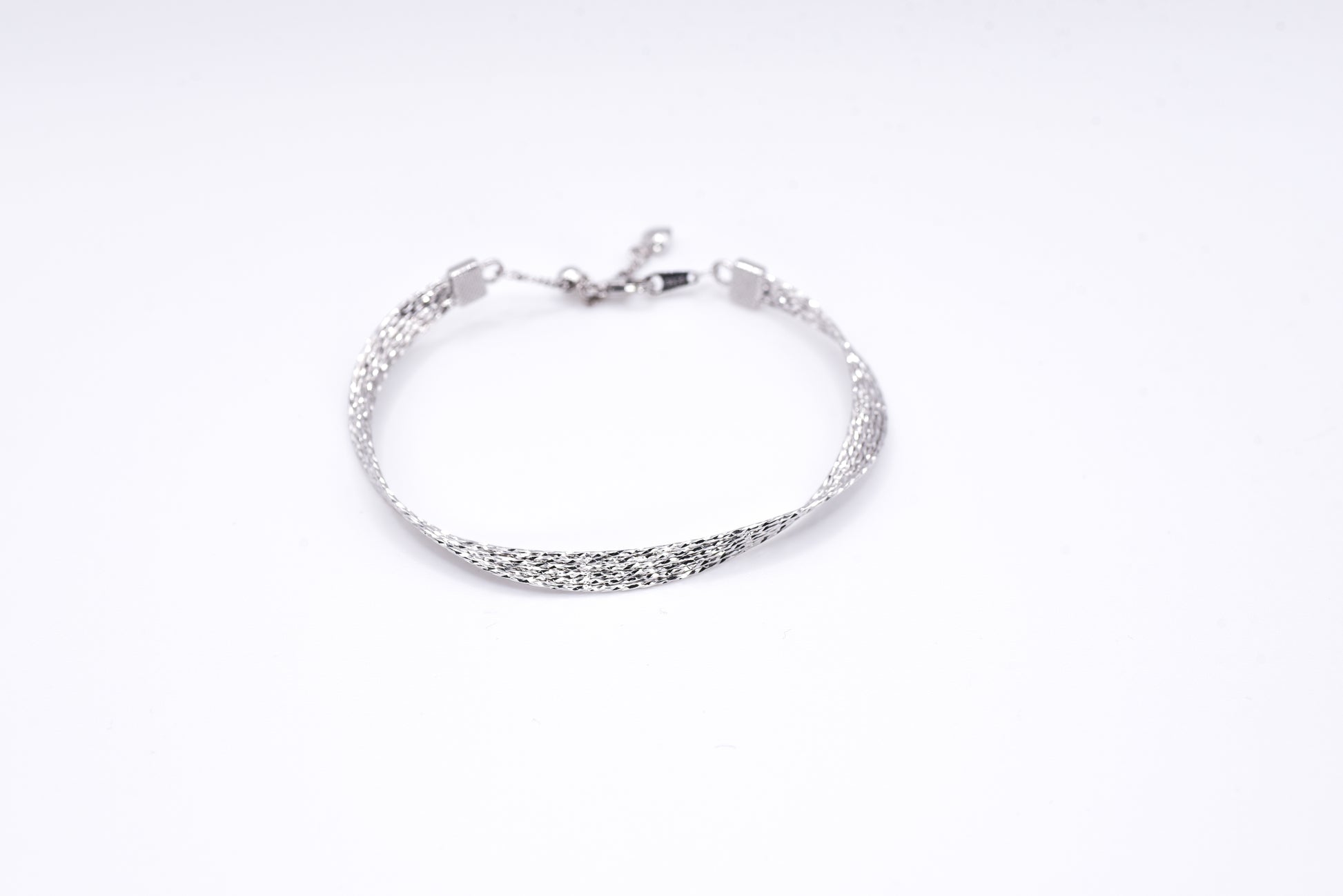 Silver bracelet on a white background