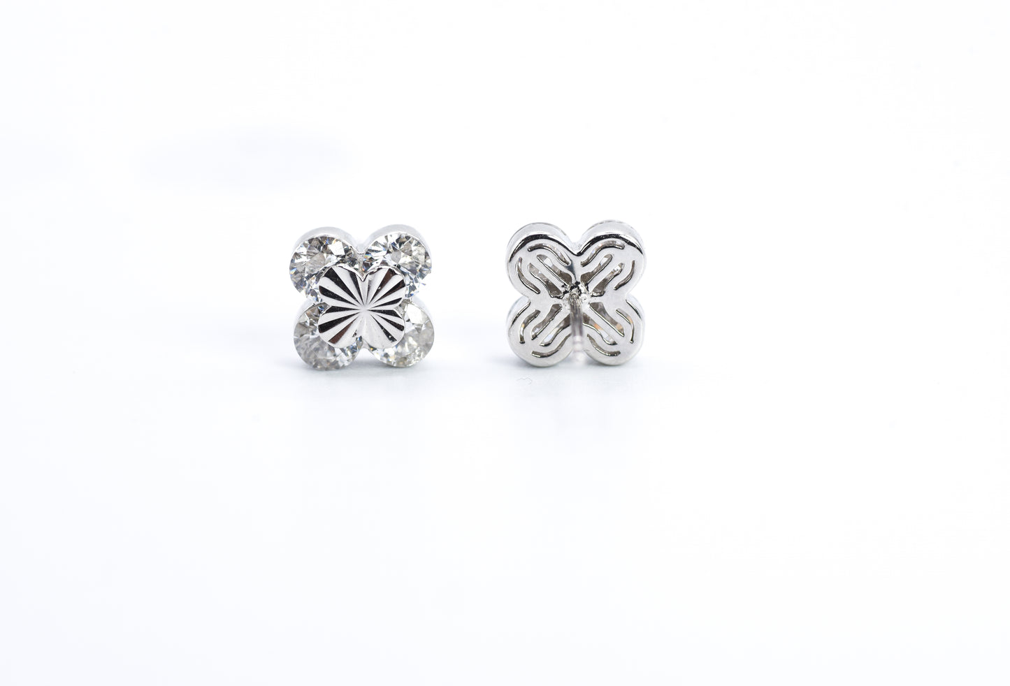 Pair of silver butterfly earrings on a white background