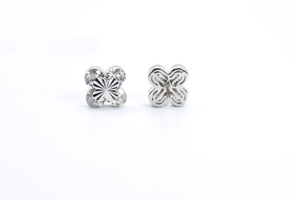 Pair of silver butterfly earrings on a white background