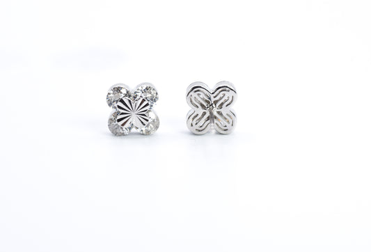 Pair of silver butterfly earrings on a white background