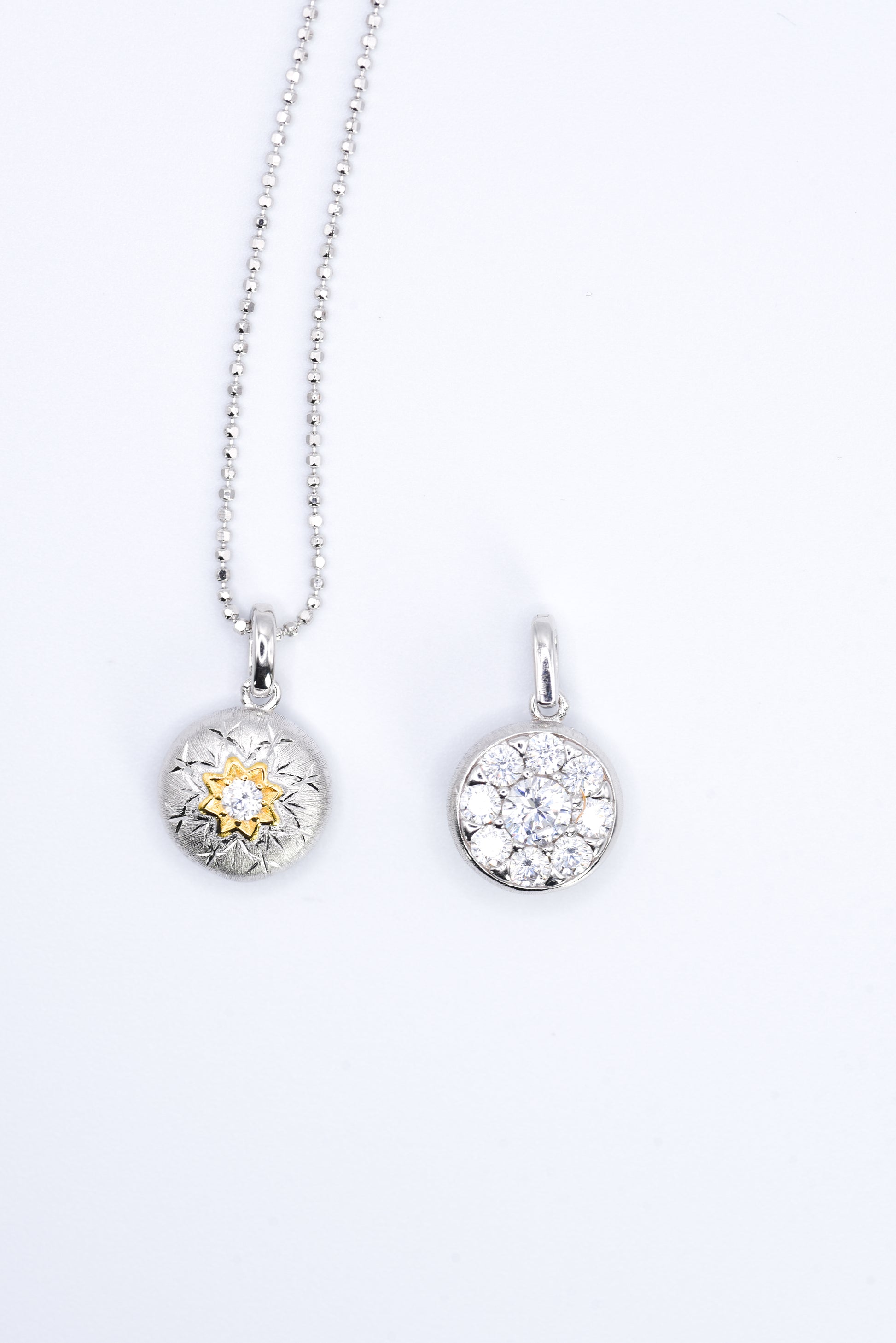 Silver necklace with a pendant on a white background