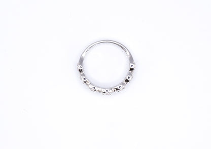 silver ring with multiple stones on a white background