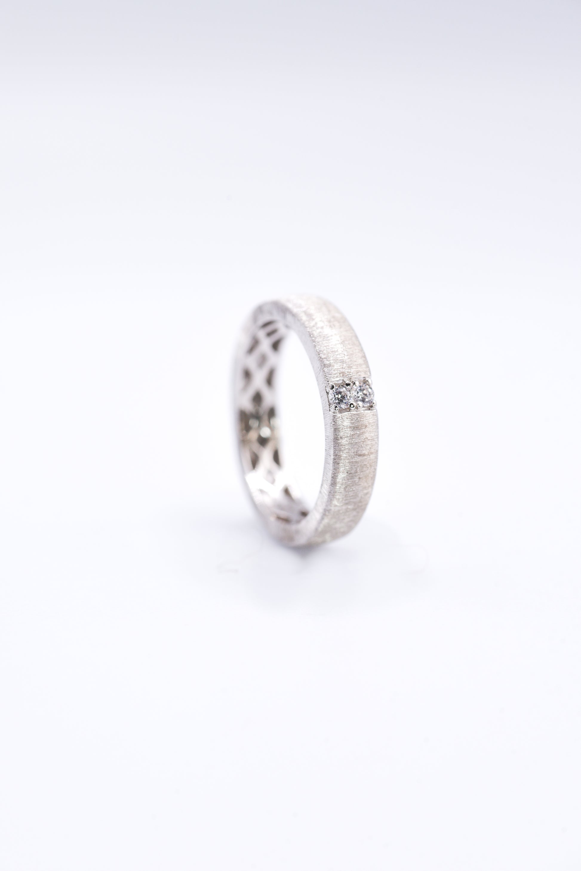 Silver ring with a gemstone on a white background