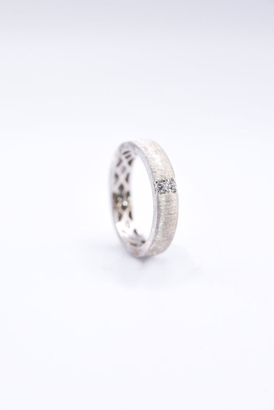 Silver ring with a gemstone on a white background