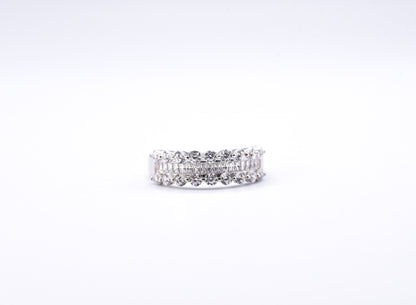 Silver ring with multiple gemstones on a white background