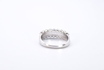 Silver ring with multiple gemstones on a white background