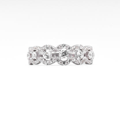 silver ring with multiple stones on a white background