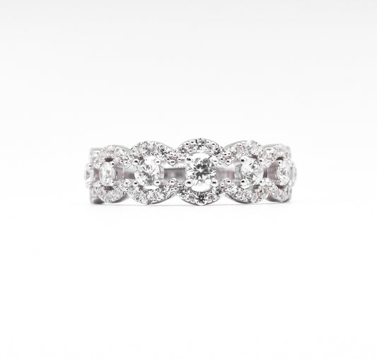 silver ring with multiple stones on a white background