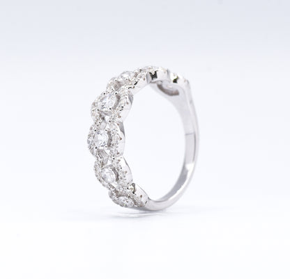 silver ring with multiple stones on a white background