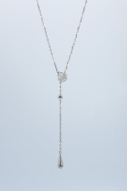 Lunelle Atelier Dew Drop Lariat Necklace featuring delicate chain and teardrop pendant on a neutral background.