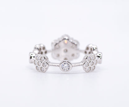 back of Silver earring with paw print design on a white background