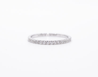 Silver ring with small stones on a white background