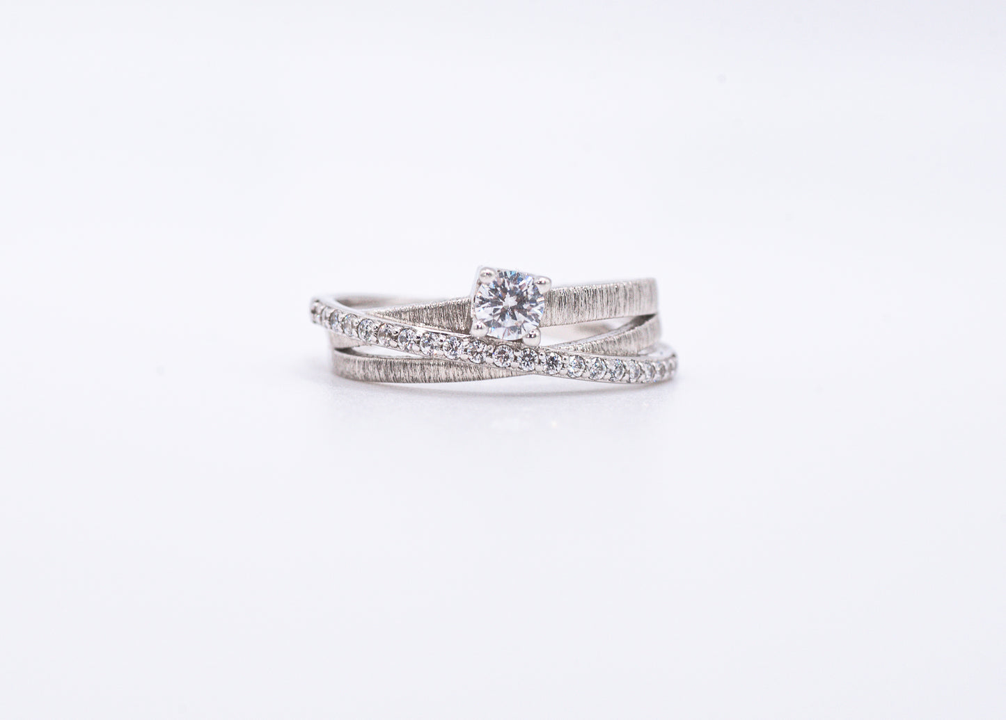 silver rings with gemstones on a white background