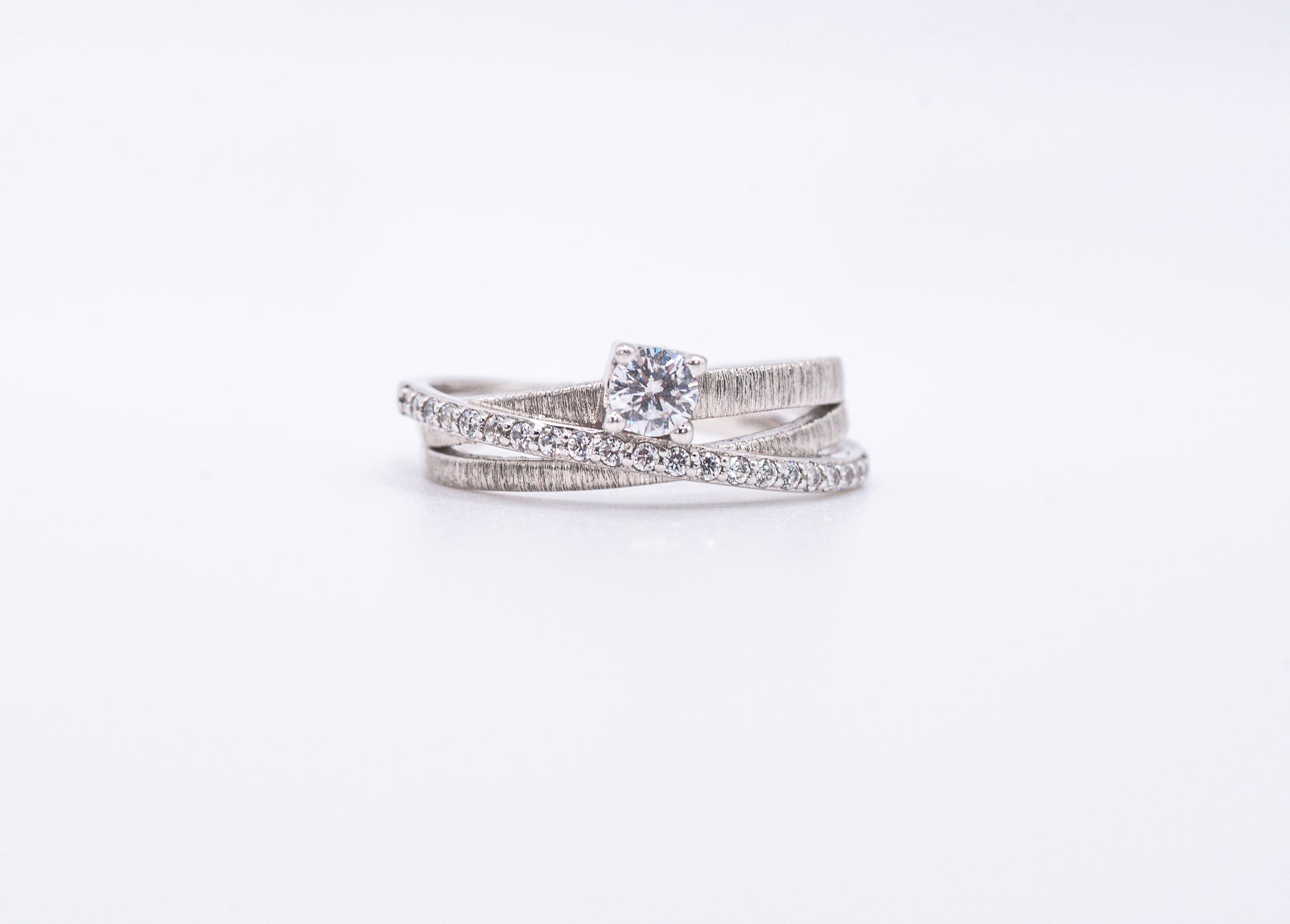 silver rings with gemstones on a white background