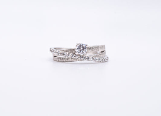 silver rings with gemstones on a white background