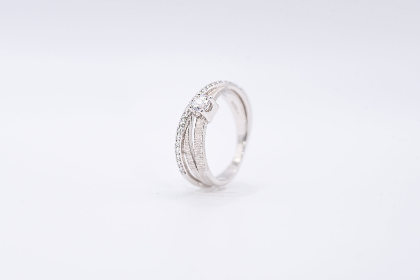 Silver ring with gemstones on a white background